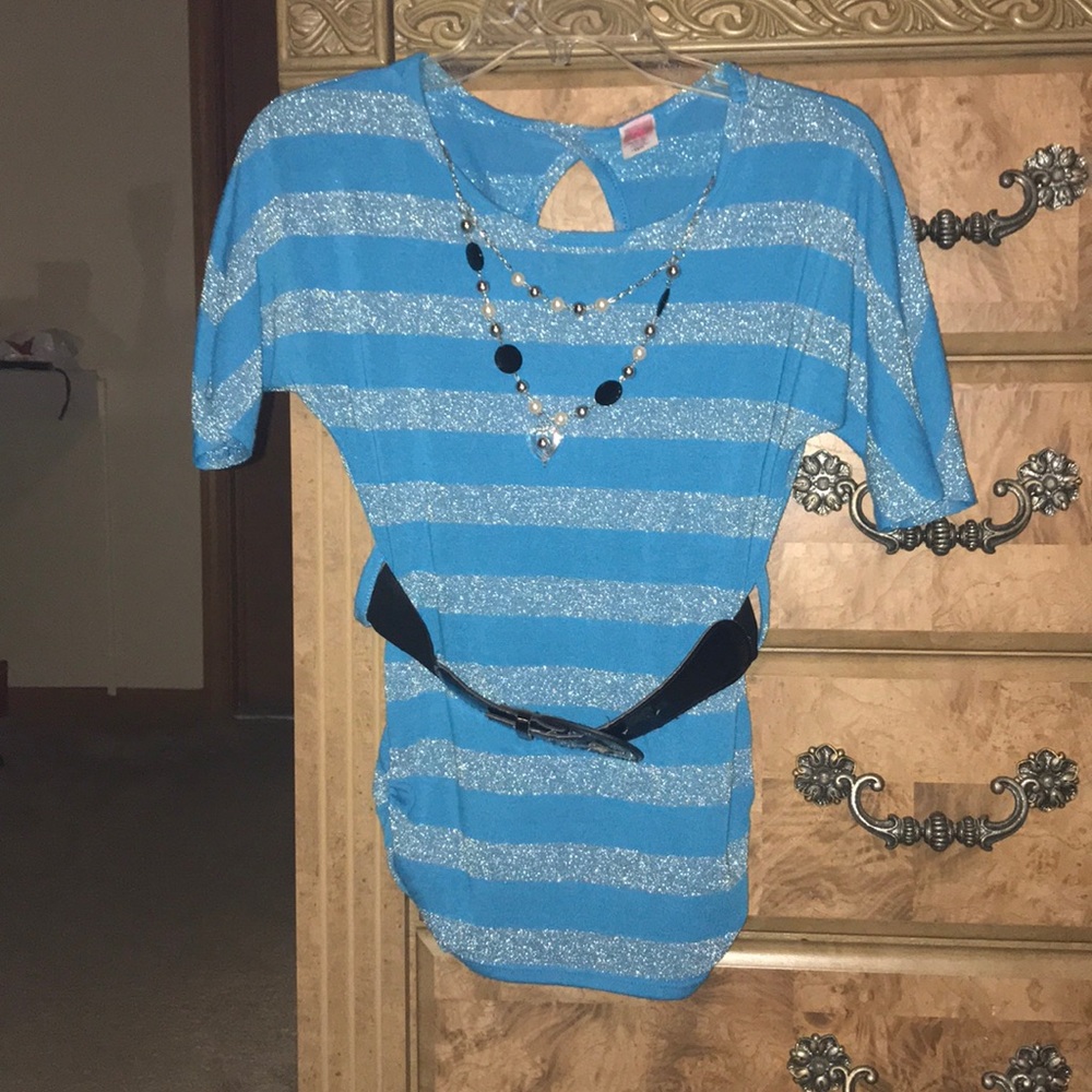 Blue and silver top, with black belt